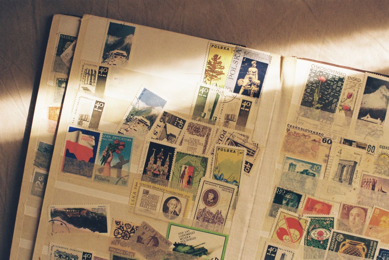 who-we-are A detailed look at a vintage collection of international stamps displayed in an album.